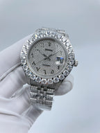 Diamond-accent bezel wristwatch with dark dial and silver metal link bracelet