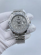 Rolex timepiece with silver-tone bracelet, diamond bezel, gray dial with baton markers