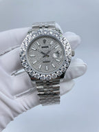 Rolex watch front view with diamond bezel and gray dial, silver link bracelet