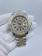 Rolex two-tone wristwatch with diamond bezel, dark dial and metal bracelet