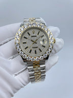 Rolex two-tone wristwatch with diamond bezel, dark dial and hour markers