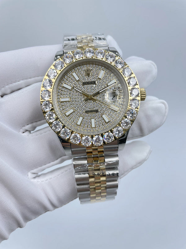 Rolex wristwatch with diamond-studded bezel, light sparkling dial, gold crown, two-tone bracelet