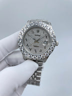 Diamond bezel wristwatch with grey dial and silver bracelet, crown at right