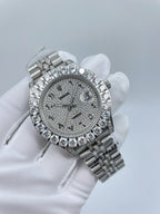 Diamond bezel wristwatch with grey dial and silver bracelet, close-up front