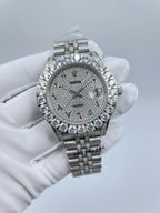 Diamond bezel wristwatch with grey dial and silver bracelet, face-on view in glove