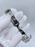Rolex watch side view with clasp and metallic bracelet on white glove