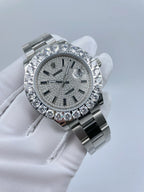 Rolex watch three-quarter view, sparkling bezel stones and gray dial