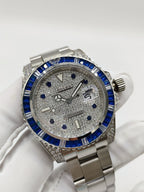 Rolex stainless steel watch with blue bezel and silver dial showing Submariner text