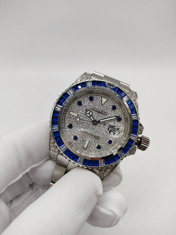 Rolex stainless steel watch with blue bezel and silver textured dial, view from front