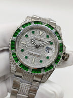 Rolex Submariner watch close-up, green bezel, sparkling bezel trim, silver bracelet