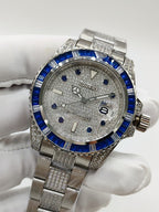Rolex Submariner-style wristwatch with blue bezel and silver textured dial