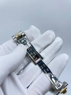Rolex stainless steel wristwatch side view with bracelet links and crown