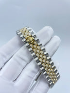 Rolex watch bracelet view with alternating silver and gold-toned links