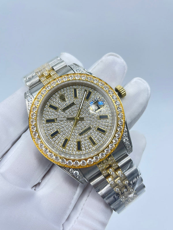 Rolex watch angled front view with silver case, gold details, and jeweled bezel