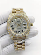 Gold-tone diamond watch with champagne dial, Roman numerals, Day-Date window, bracelet