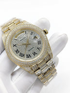 Gold-tone diamond watch with champagne dial, Roman numerals, crown and bracelet detail