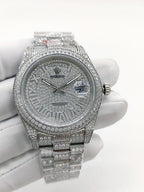 Diamond-set silver analog watch with textured dial and jeweled bracelet