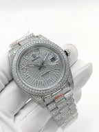 Rolex diamond watch with jeweled bezel, silver dial, and link bracelet