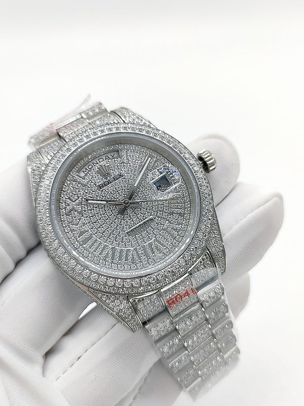 Rolex diamond watch with jeweled bezel, silver dial, and link bracelet