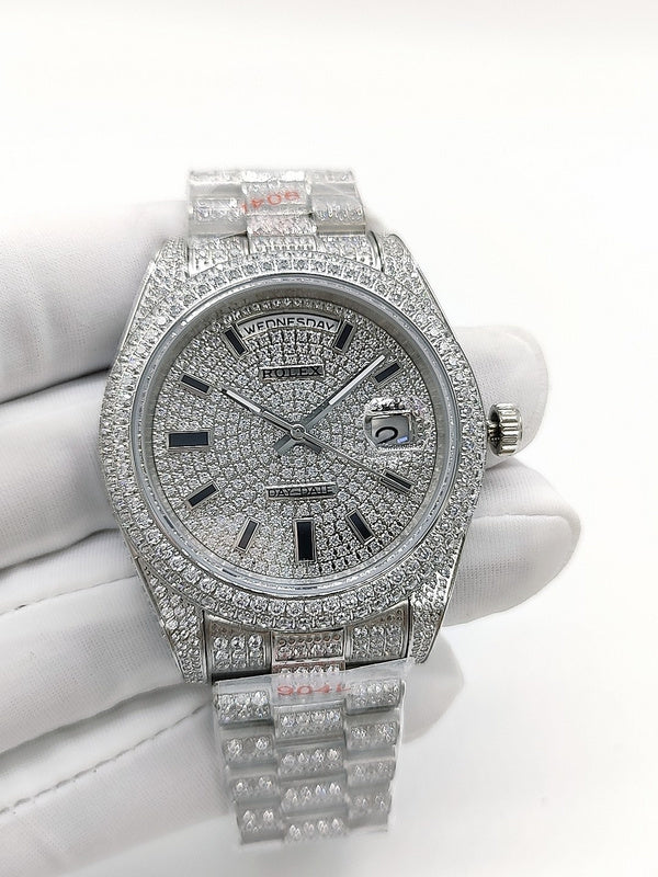 Rolex diamond-accent watch front view with silver dial, Roman numerals, and bezel