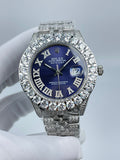 Rolex Datejust watch with blue dial, diamond bezel, and silver rhinestone bracelet