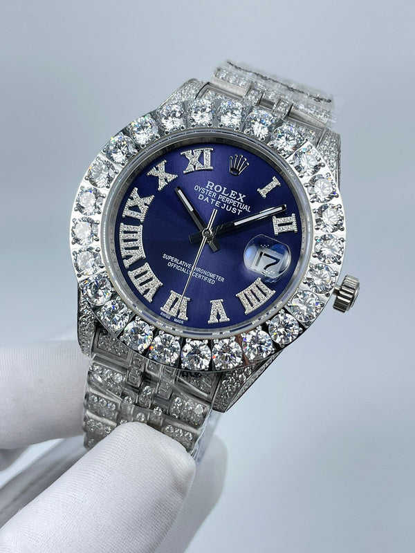 Rolex Datejust watch front view with blue dial, diamond bezel, and Roman numerals