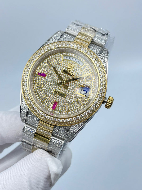 Diamond-set wristwatch with gold dial, colorful markers, and silver bracelet