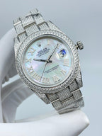 Rolex Datejust watch front view, pale mother-of-pearl dial with date window, diamond bezel