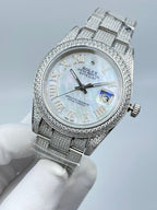 Rolex Datejust watch dial close-up with Roman numerals and date window