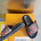 Louis Vuitton slide sandals featuring dark monogram canvas with red cherries and leather-like straps