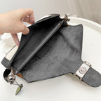 Coah bag open tote with gray lining, zipper details, adjustable shoulder strap