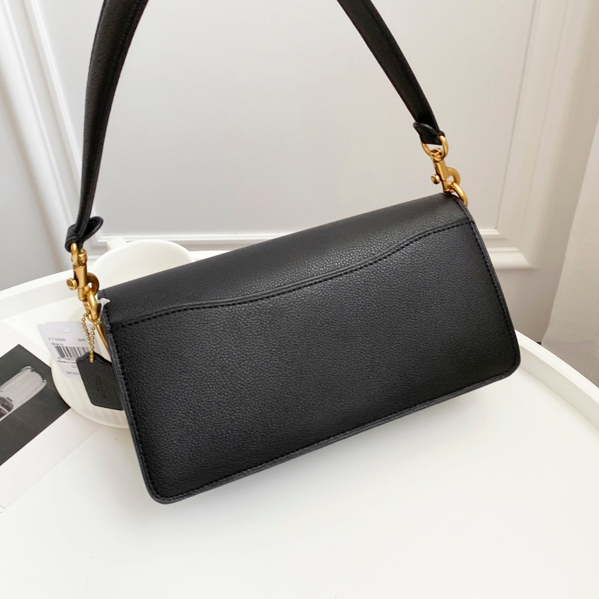 Coah bag black crossbody with long rectangular flap and gold chain hardware