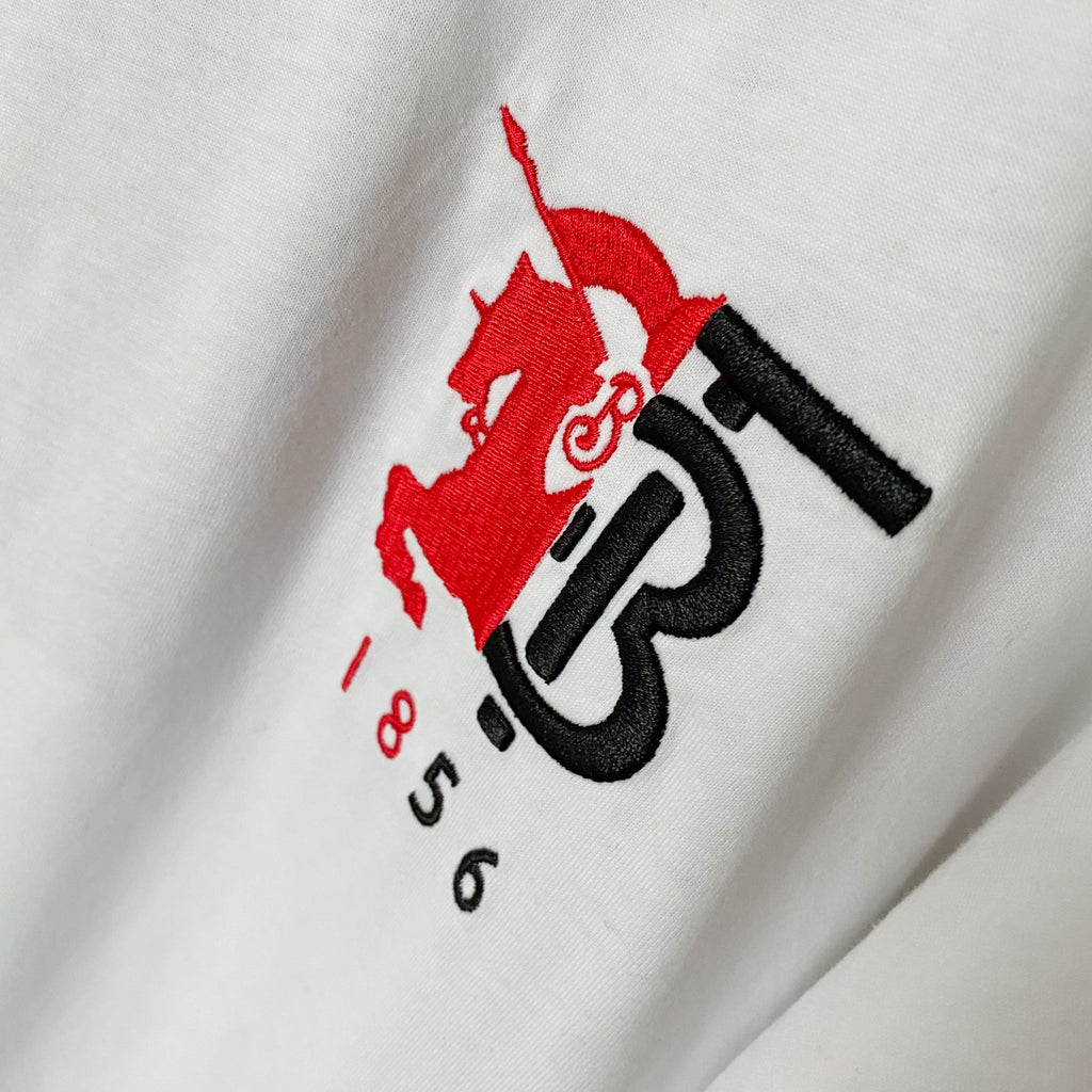 Close-up of Burberry red and black 1856 logo print on white T-shirt
