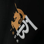 Close-up of Burberry embroidered logo on black short-sleeve T-shirt