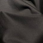 Dark T-shirt fabric close-up with fine woven texture