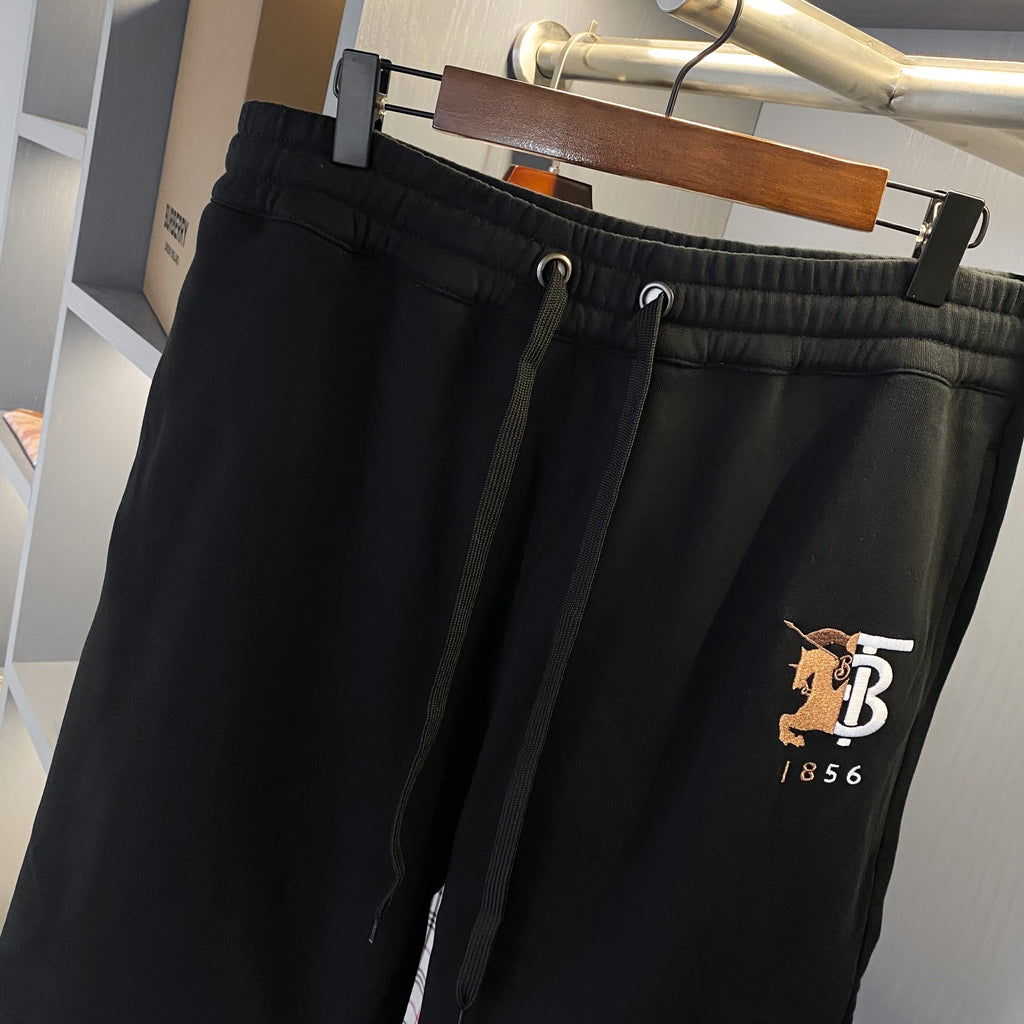 Black Burberry drawstring shorts with front pockets and embroidered TB logo