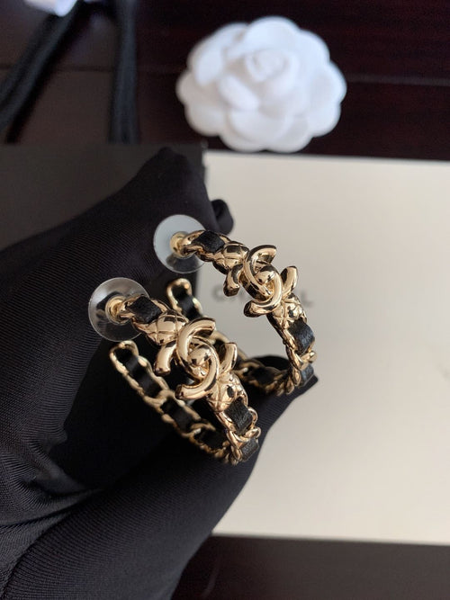Gold-tone chain hoop earrings with black enamel links
