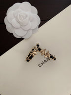 Gold-tone chain hoop earrings with black enamel and CHANEL charm