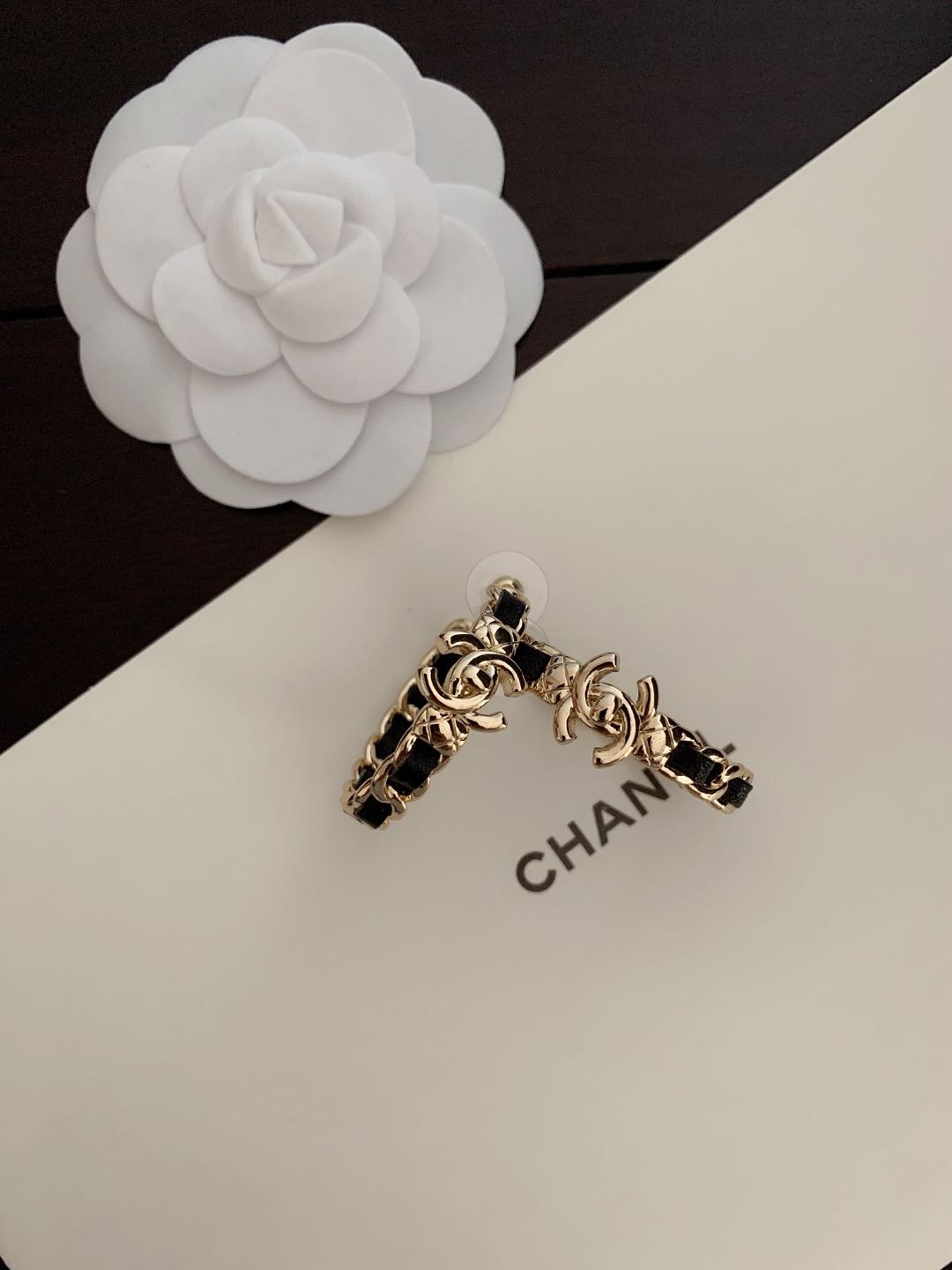 Gold-tone chain hoop earrings with black enamel and CHANEL charm