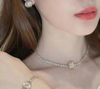 Rhinestone choker necklace with round logo medallion pendant and fine chain band