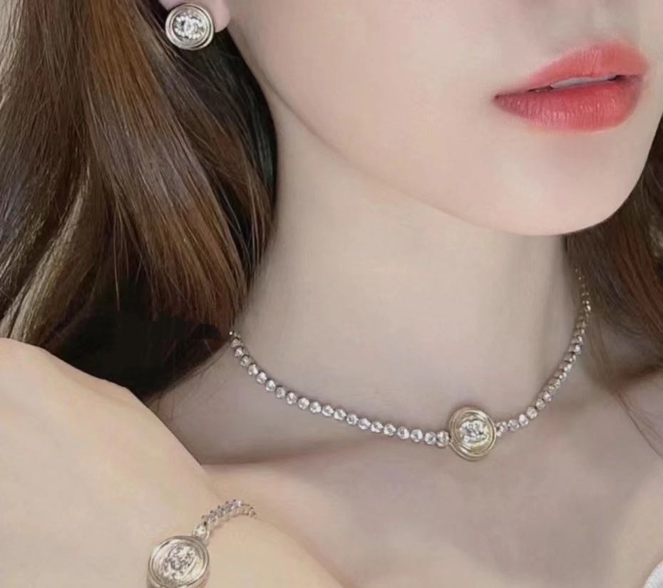 Rhinestone choker necklace with round logo medallion pendant and fine chain band