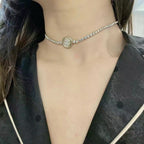 Silver-tone rhinestone choker necklace with round logo medallion pendant