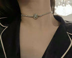 Rhinestone choker necklace with round logo medallion center pendant