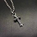 Silver-tone cross pendant necklace with curb chain links