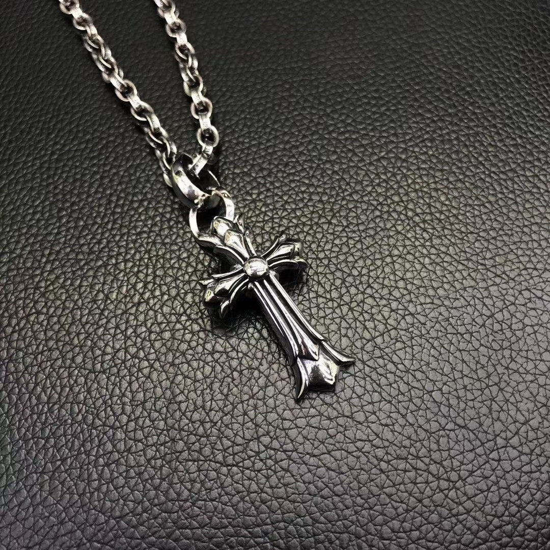 Silver-tone cross pendant necklace with curb chain links