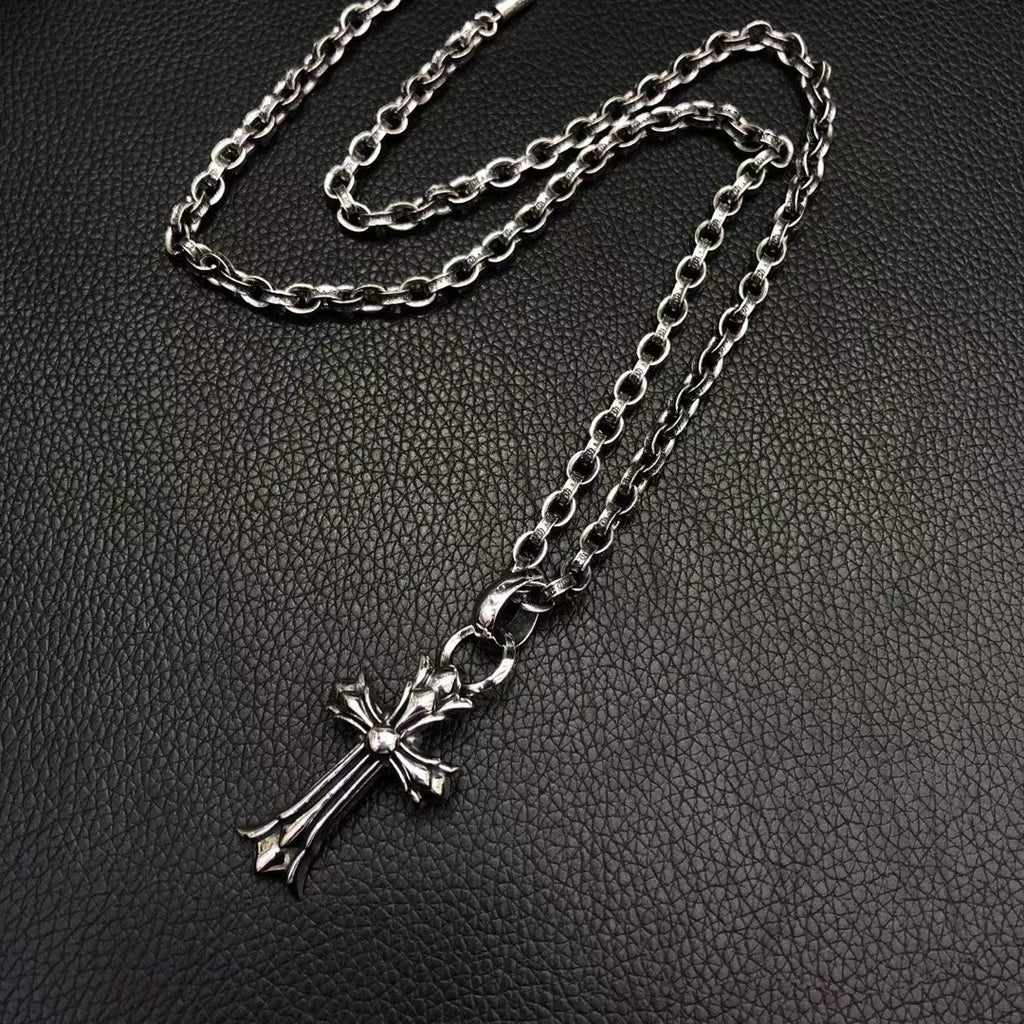 Silver-tone cross pendant necklace with long chain and clasp