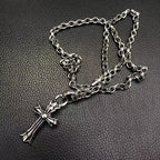 Silver-tone cross pendant necklace with layered chain links