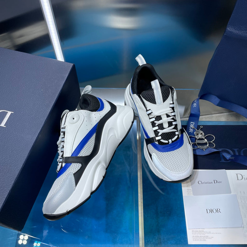 Dior unisex sneakers, white leather-look with black panels and blue side stripe