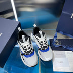 Dior unisex sneakers pair, white mesh with black laces and blue trim detail