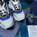 Dior unisex sneakers close-up, textured knit upper with black laces and blue edge
